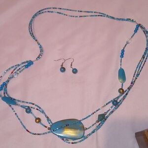 Handmade blue beaded necklace with matching earrings